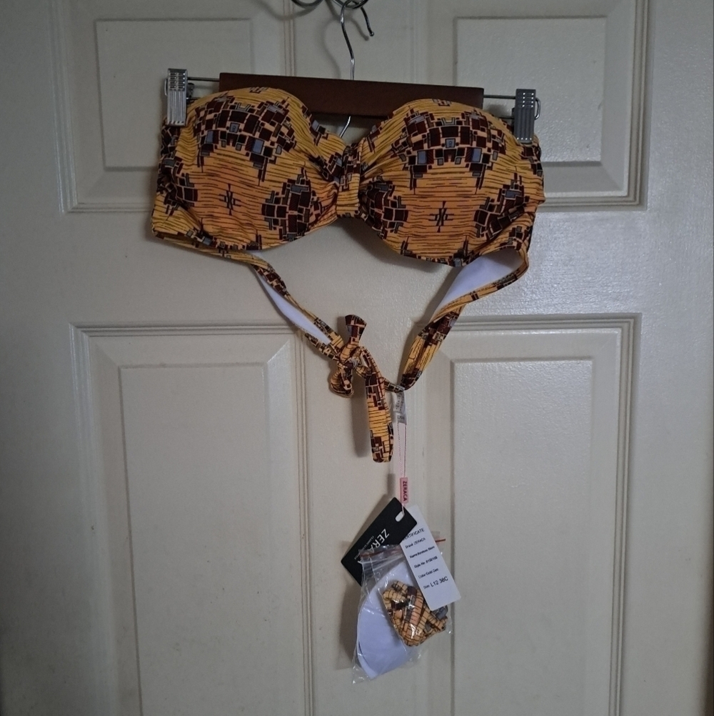 Zeraca bikini top size 38C has extra cups and has string also